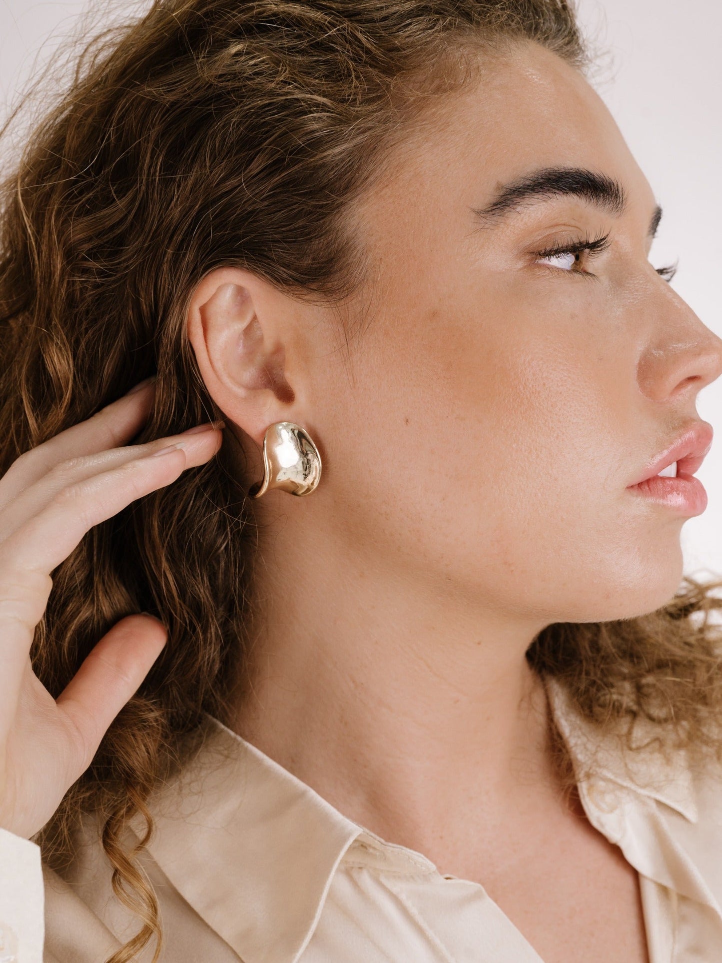 Sleek Curved Silver Stud Earrings