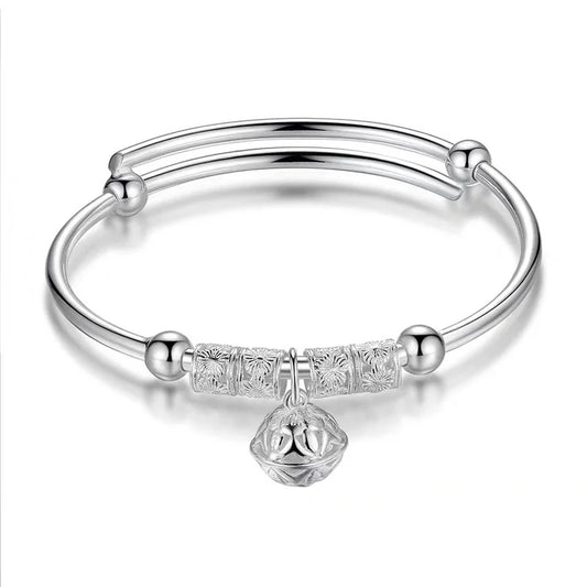 Silver Bangle Bracelet Featuring Elegant Charm Design