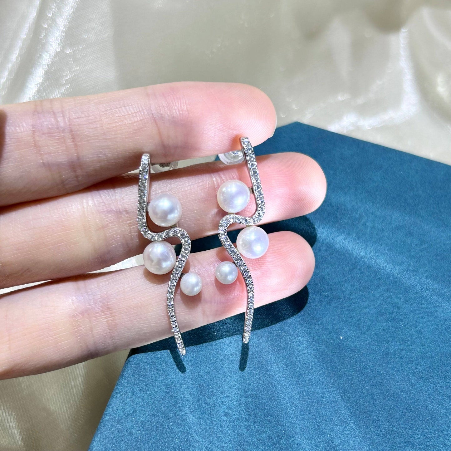 Elegant Curve Silver and Freshwater Pearl Studs