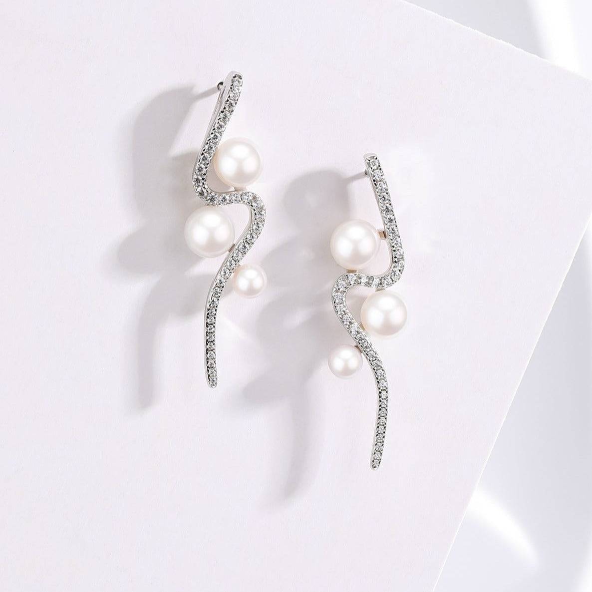 Elegant Curve Silver and Freshwater Pearl Studs