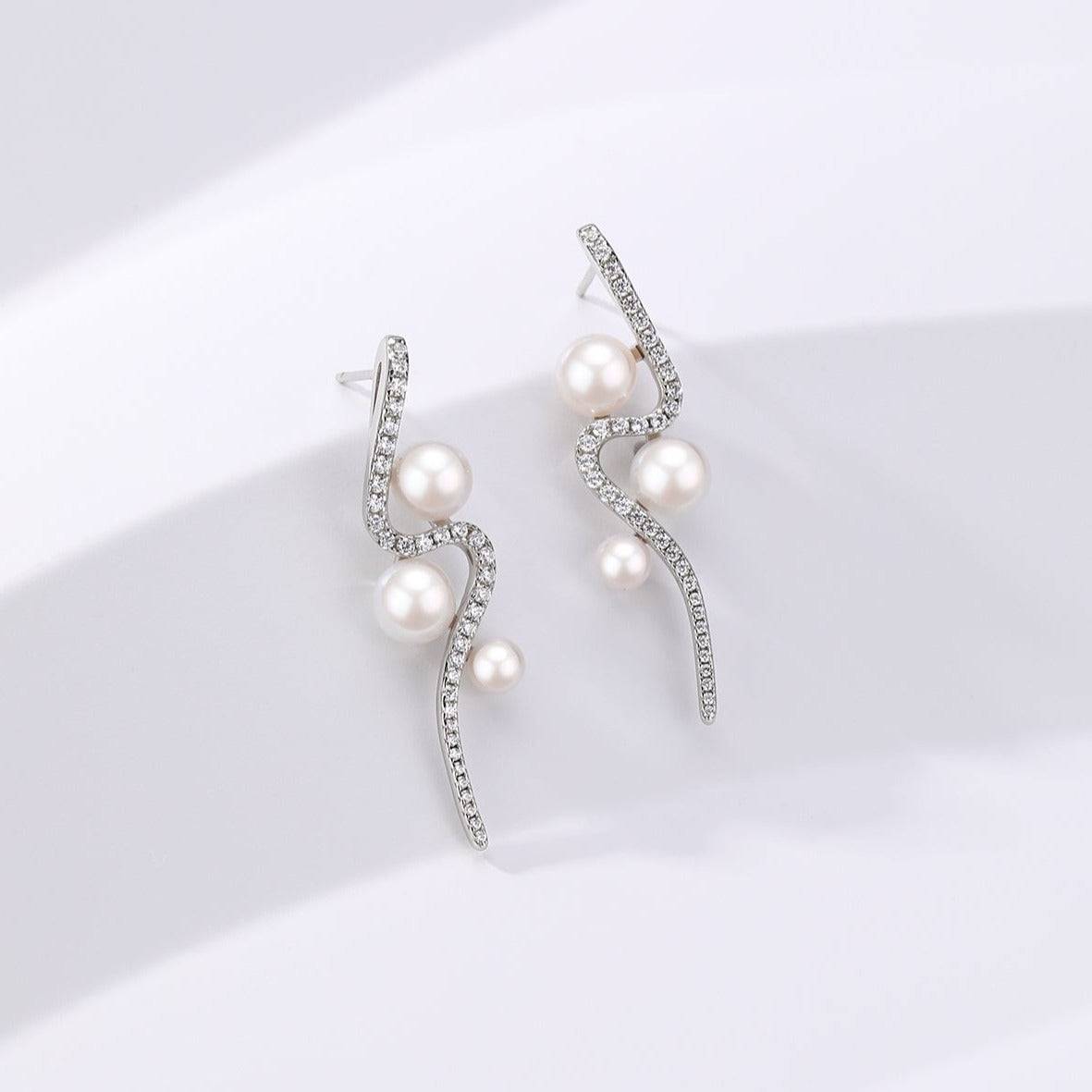 Elegant Curve Silver and Freshwater Pearl Studs