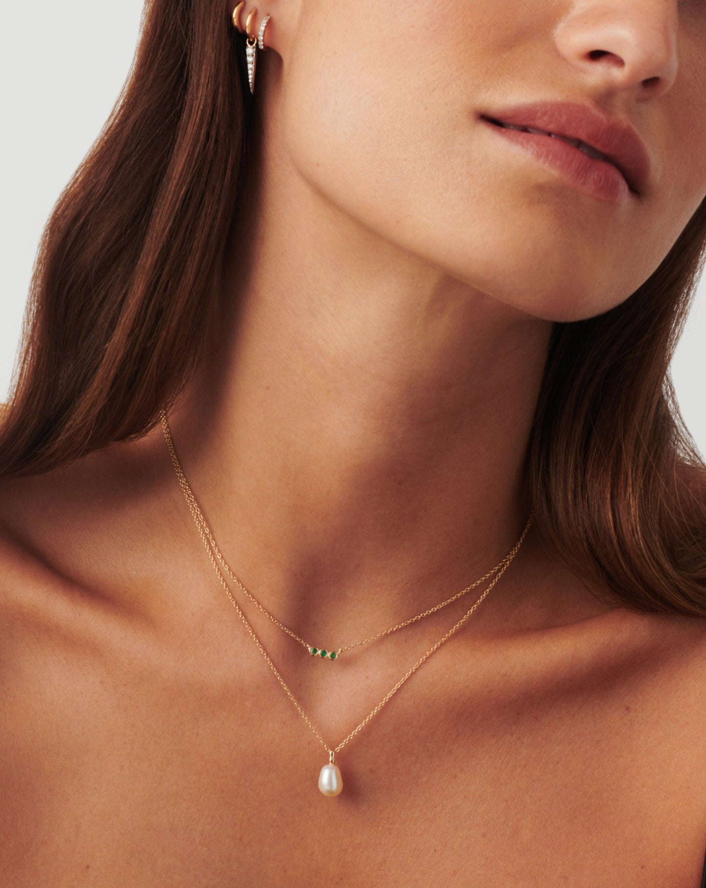 Emerald Solitaire Trio Necklace in Fine Design