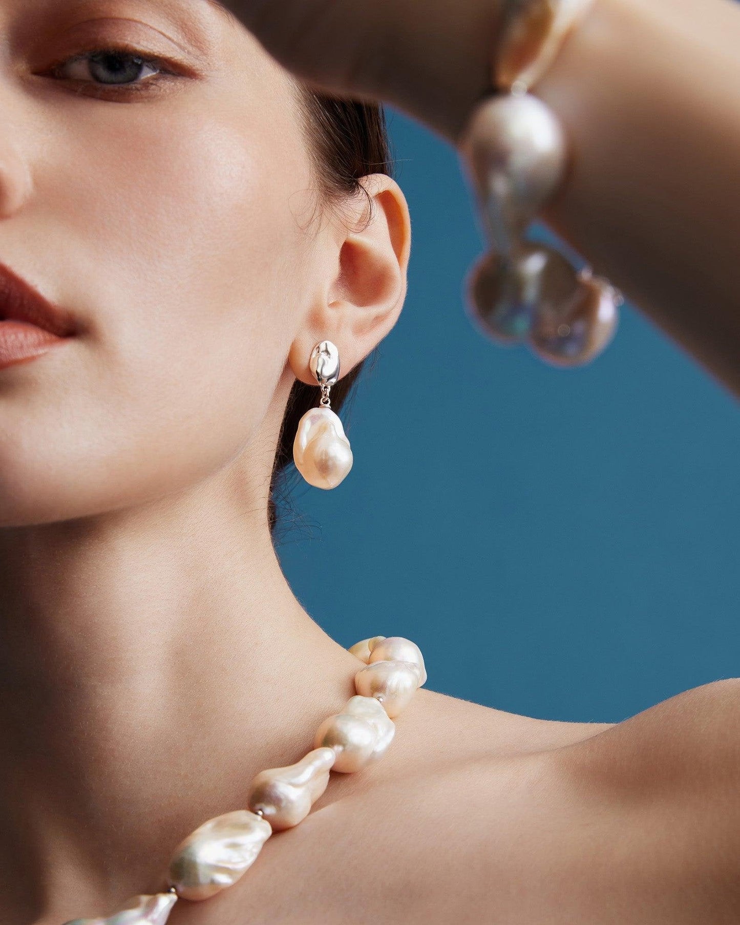 Baroque Pearl Earrings with Glimmering Waves Design